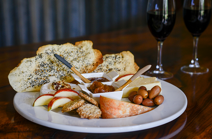 Enjoy a glass of our organic wine with local cheese and produce at the Cellar Door